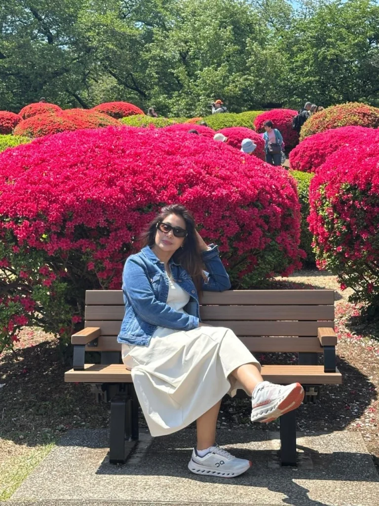 Actress Preeti Mallapurkar sitting on a bench in a park in Tokyo, Japan.