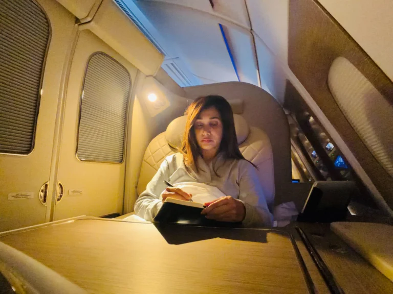 Preeti Mallapurkar sitting in her personal cabin while travelling & noting down her ideas to compile her thoughts for her upcoming Book.