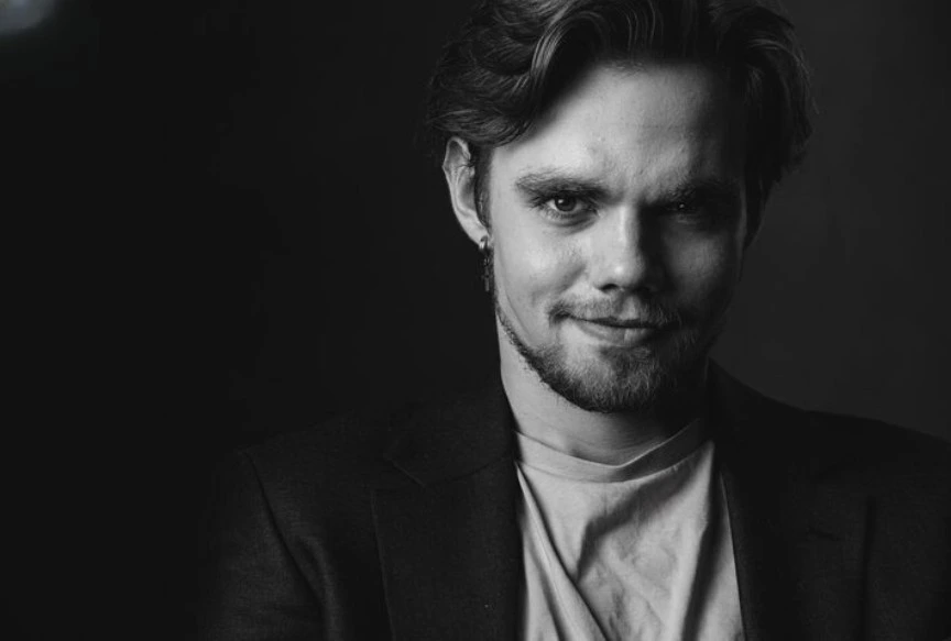 serious man looking into camera black and white portrait