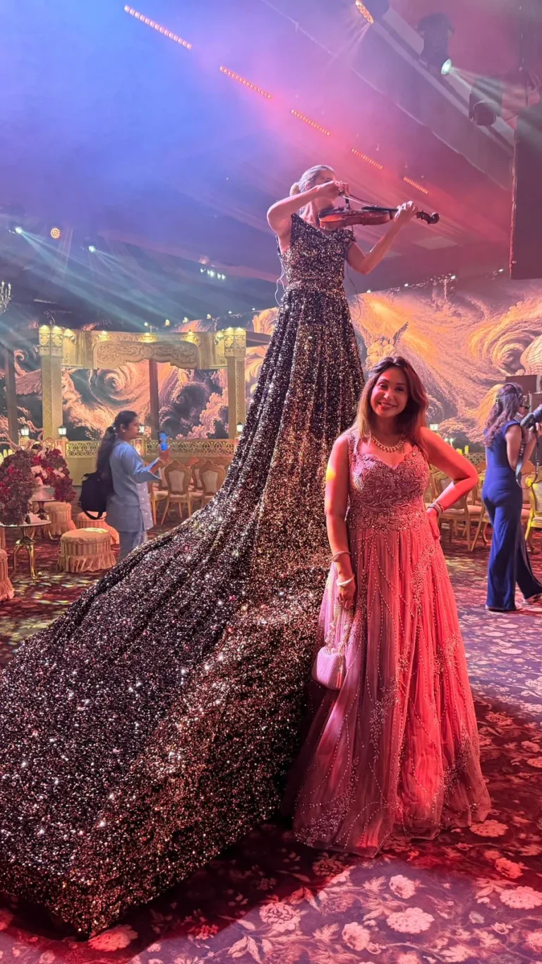 Indian marathi actress Preeti, standing on a beautiful setup wearing a soft pink outfit in an event.