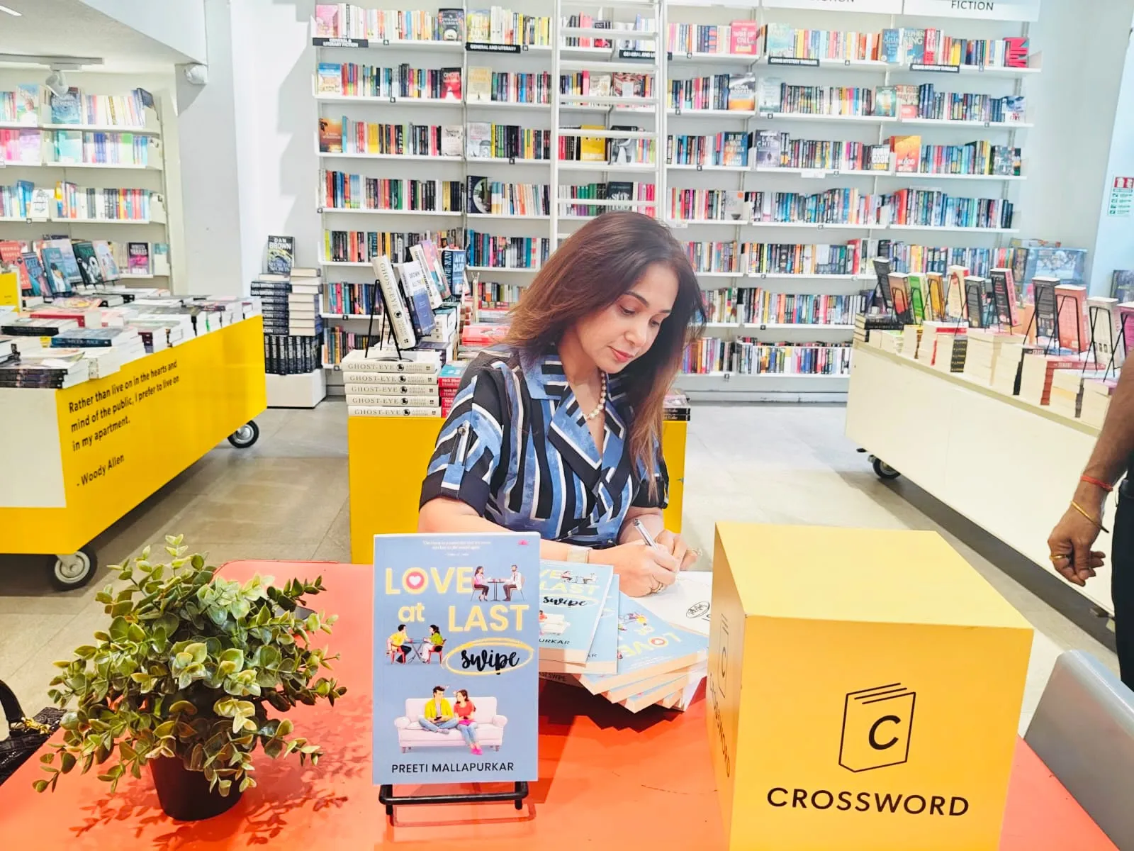 Preeti-Mallapurkar-signing her book Love At Last Swipe in Crossword Mumbai